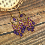 These Bohema Ethnic Fringed Tassel Earrings boast a stylish geometric shape and are crafted with a glossy acrylic water drop. Women of all ages will love wearing these beautiful metal earrings.