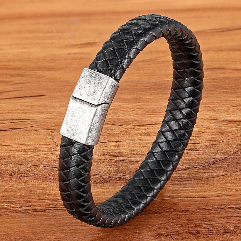 Experience masculine elegance with this Genuine Leather/Stainless Steel Bracelet! Designed with a Classic Shape and Geometric Pattern, this timeless men's bracelet radiates classic style. Let this refined, braided black bracelet elevate your style!