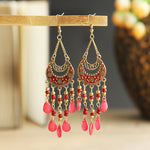 These Bohema Ethnic Fringed Tassel Earrings boast a stylish geometric shape and are crafted with a glossy acrylic water drop. Women of all ages will love wearing these beautiful metal earrings.