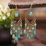 These Bohema Ethnic Fringed Tassel Earrings boast a stylish geometric shape and are crafted with a glossy acrylic water drop. Women of all ages will love wearing these beautiful metal earrings.