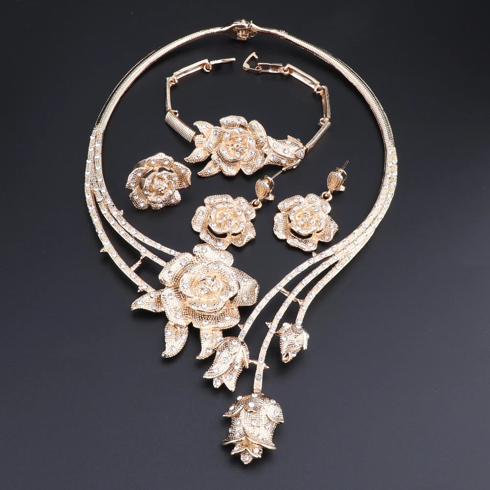 Enhance your wedding day style with this elegant jewelry set, consisting of a gold-colored crystal rose flower necklace, earrings, ring, and bangle, ideal for bridal accessories.