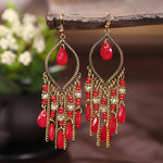 These Bohema Ethnic Fringed Tassel Earrings boast a stylish geometric shape and are crafted with a glossy acrylic water drop. Women of all ages will love wearing these beautiful metal earrings.