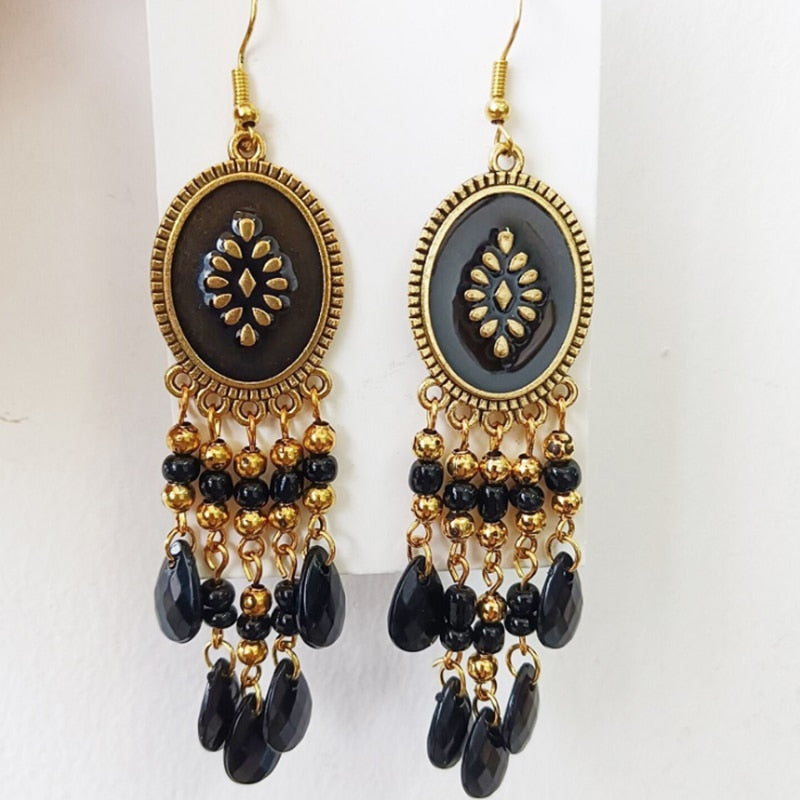 These Bohema Ethnic Fringed Tassel Earrings boast a stylish geometric shape and are crafted with a glossy acrylic water drop. Women of all ages will love wearing these beautiful metal earrings.