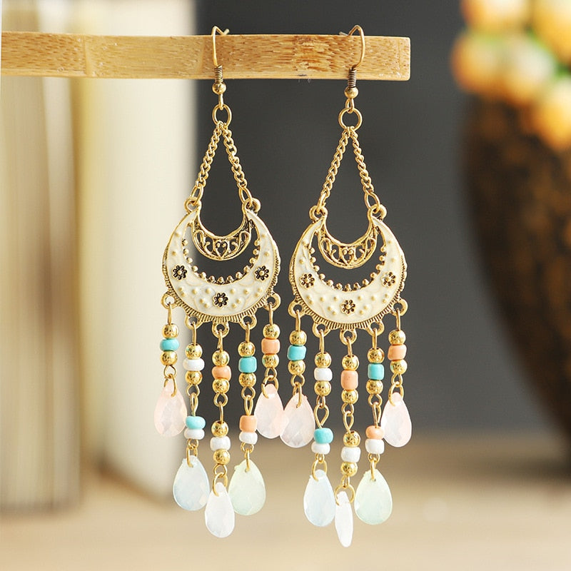 These Bohema Ethnic Fringed Tassel Earrings boast a stylish geometric shape and are crafted with a glossy acrylic water drop. Women of all ages will love wearing these beautiful metal earrings.