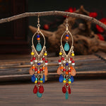 These Bohema Ethnic Fringed Tassel Earrings boast a stylish geometric shape and are crafted with a glossy acrylic water drop. Women of all ages will love wearing these beautiful metal earrings.