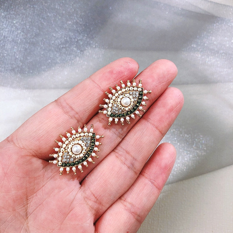 Fashion-forward and flashy, these Geometric Rhinestone Evil Eye Statement Earrings offer beauty and style. Perfect for any look, these stunning earrings are crafted for women, making sure you dazzle wherever you go!