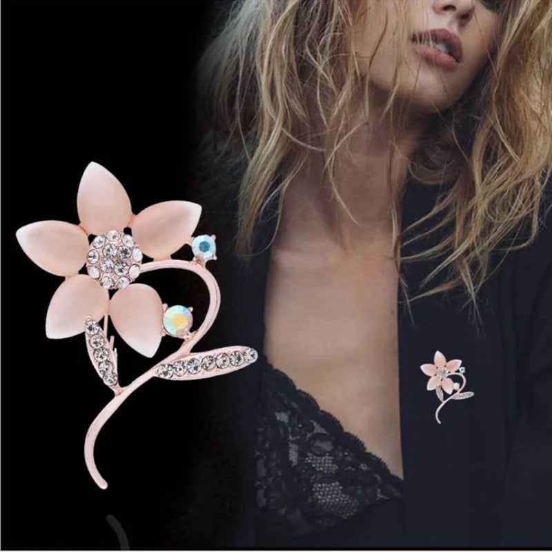 A stunning collection of opal stone and rhinestone brooches featuring rose flower designs. These exquisite brooches are perfect for women to accessorize their fashion clothing, especially for weddings. They make wonderful gifts for any occasion and are a must-have addition to any jewelry collection.