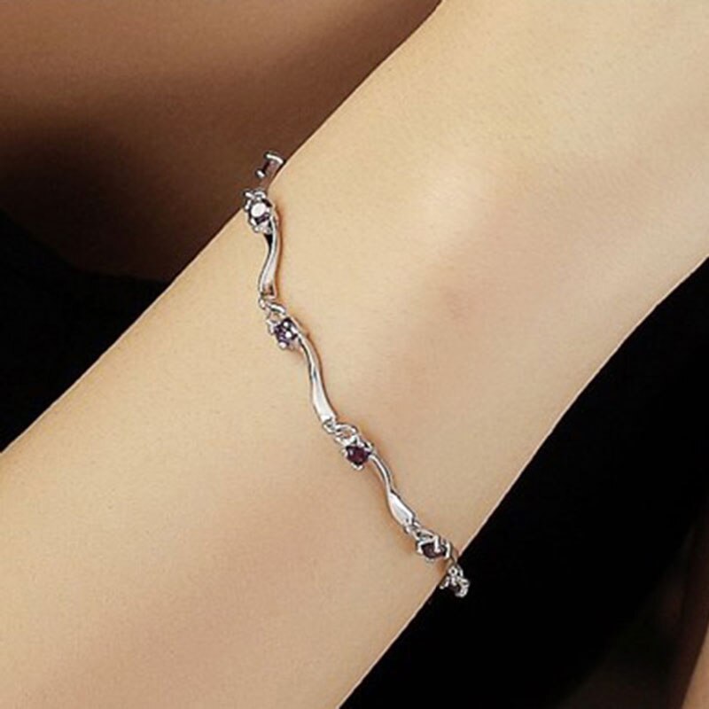 This stunning Purple Cubic Zircon Crystal Bracelet is a must have accessory! Featuring an exquisite geometric shape and an easy-hook clasp, the stunning snake chain is sure to make an unforgettable statement. An absolute essential for any savvy fashionista, this gorgeous bracelet is made of Cubic Zirconia, perfect for Women!