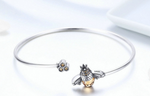 Stunningly crafted with exquisite 925 sterling silver, this Trendy Bee Bangle sparkles with beautiful Zircon stones! With a diameter of 6.5cm, this delightful piece is perfect for stylish women of any age! Look and feel your best wearing this exquisite piece of jewelry!