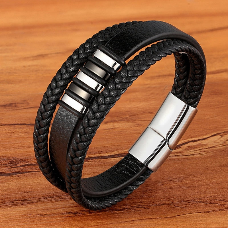 Experience masculine elegance with this Genuine Leather/Stainless Steel Bracelet! Designed with a Classic Shape and Geometric Pattern, this timeless men's bracelet radiates classic style. Let this refined, braided black bracelet elevate your style!