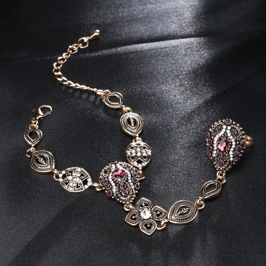 The exquisite vintage jewelry sets featuring fashion crystal flower designs, including unique bracelets and rings for women. These luxurious pieces are crafted in gold color, showcasing the elegance of Turkey's finest jewelry.
