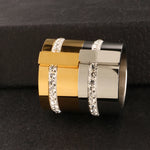 Elevate your style with our exquisite collection of wide rings for women. Crafted from high-quality stainless steel, these silver-colored rings feature a single row of sparkling cubic zirconia, adding a touch of luxury to any outfit. Perfect for wedding bands or everyday wear, these rings are designed to make a statement and enhance your femininity. Explore our range and find the perfect ring for you.