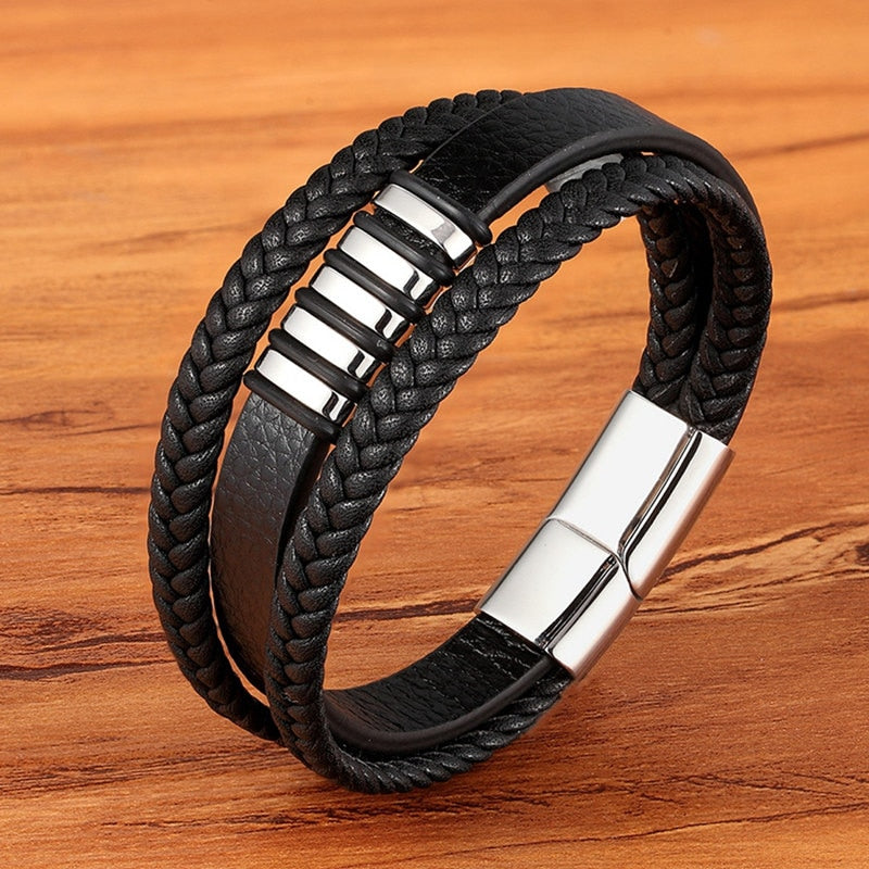 Experience masculine elegance with this Genuine Leather/Stainless Steel Bracelet! Designed with a Classic Shape and Geometric Pattern, this timeless men's bracelet radiates classic style. Let this refined, braided black bracelet elevate your style!