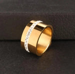 Elevate your style with our exquisite collection of wide rings for women. Crafted from high-quality stainless steel, these silver-colored rings feature a single row of sparkling cubic zirconia, adding a touch of luxury to any outfit. Perfect for wedding bands or everyday wear, these rings are designed to make a statement and enhance your femininity. Explore our range and find the perfect ring for you.