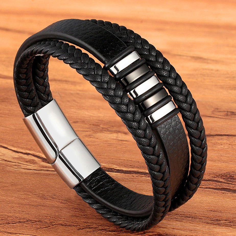 Experience masculine elegance with this Genuine Leather/Stainless Steel Bracelet! Designed with a Classic Shape and Geometric Pattern, this timeless men's bracelet radiates classic style. Let this refined, braided black bracelet elevate your style!