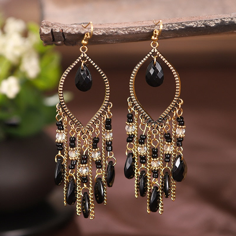 These Bohema Ethnic Fringed Tassel Earrings boast a stylish geometric shape and are crafted with a glossy acrylic water drop. Women of all ages will love wearing these beautiful metal earrings.