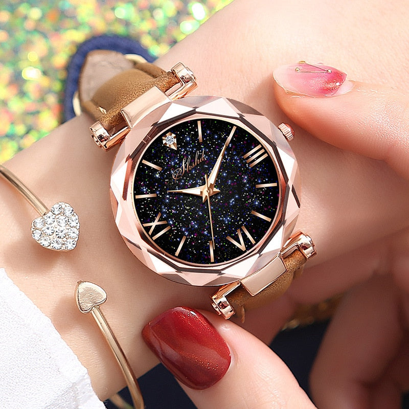 Rhinestone Romantic Starry Sky Women's Luxury Watch - A celestial-themed watch with twinkling rhinestones on the dial, Tungsten Steel case, and a luxurious leather band.