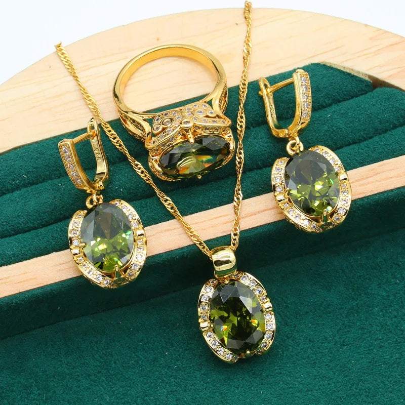 The exquisite Geometric Wedding Gold Color Jewelry Set for Women, featuring a stunning Olive Green Zircon Bracelet, Earrings, Necklace, Pendant, and Ring. This set makes a perfect gift for any occasion.