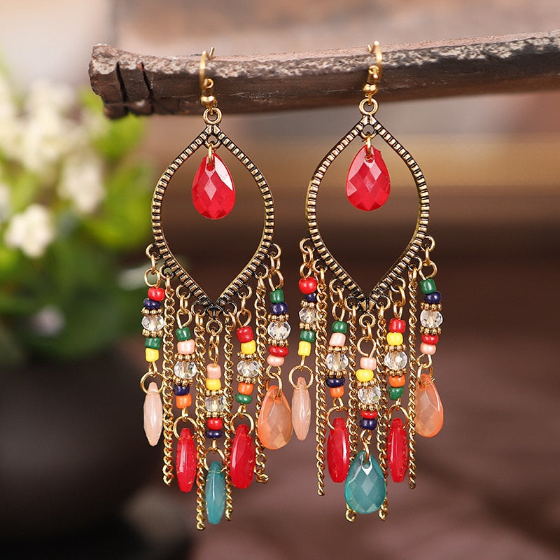 These Bohema Ethnic Fringed Tassel Earrings boast a stylish geometric shape and are crafted with a glossy acrylic water drop. Women of all ages will love wearing these beautiful metal earrings.