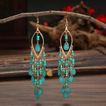 These Bohema Ethnic Fringed Tassel Earrings boast a stylish geometric shape and are crafted with a glossy acrylic water drop. Women of all ages will love wearing these beautiful metal earrings.