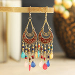 These Bohema Ethnic Fringed Tassel Earrings boast a stylish geometric shape and are crafted with a glossy acrylic water drop. Women of all ages will love wearing these beautiful metal earrings.