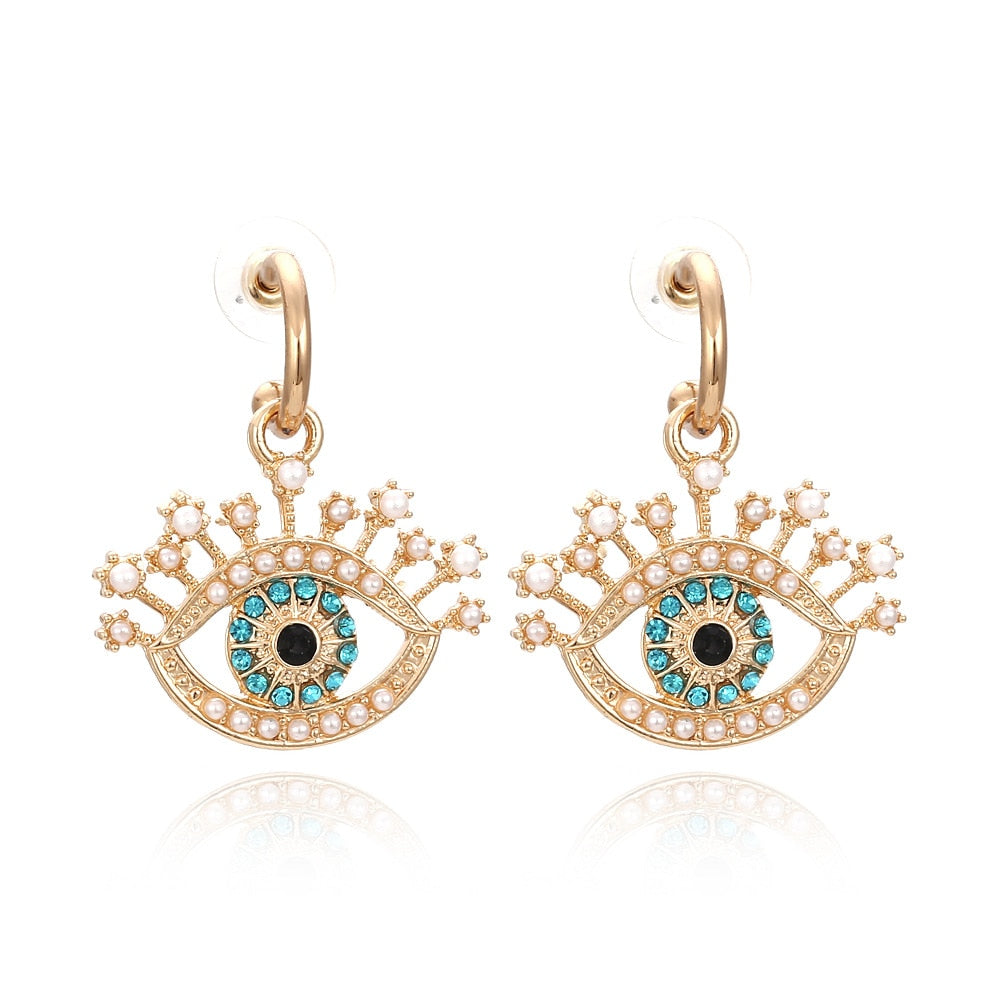 Fashion-forward and flashy, these Geometric Rhinestone Evil Eye Statement Earrings offer beauty and style. Perfect for any look, these stunning earrings are crafted for women, making sure you dazzle wherever you go!