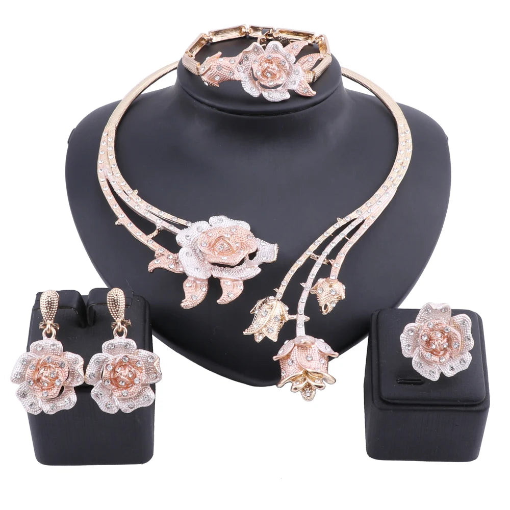 Enhance your wedding day style with this elegant jewelry set, consisting of a gold-colored crystal rose flower necklace, earrings, ring, and bangle, ideal for bridal accessories.