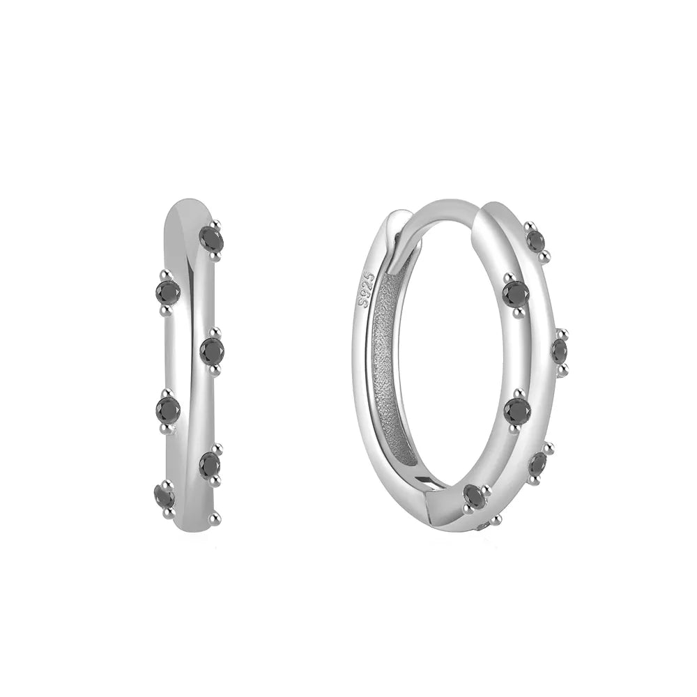 These small huggie earrings are made of 925 sterling silver with a glossy gold color finish, perfect for cartilage piercings. The fine jewelry accessories are designed to add a touch of elegance to any outfit.