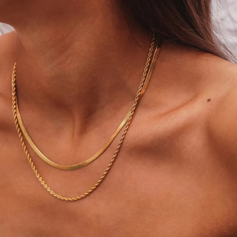 This trendy jewelry gift is a multilayer necklace made of stainless steel chain, designed for women. It has a simple fashion style with a golden color, making it a perfect accessory for parties. The necklace is hypoallergenic, ensuring it is safe for those with sensitive skin.