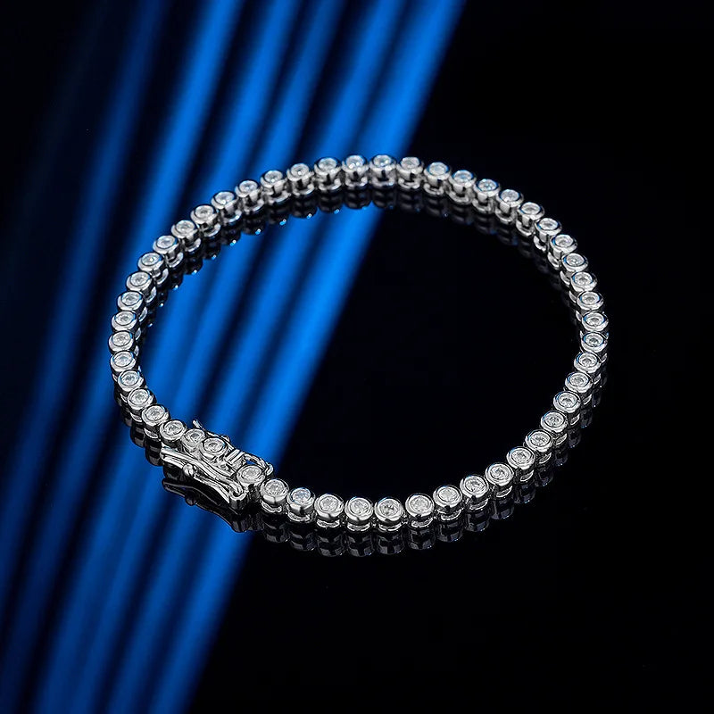 This bracelet is a stylish accessory suitable for both women and men. It features a tennis design and is made with GRA 100% Sterling Silver, which is then plated with 18k White Gold for an elegant touch.
