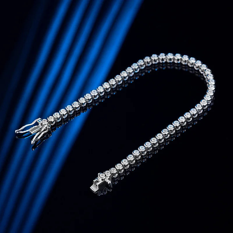 This bracelet is a stylish accessory suitable for both women and men. It features a tennis design and is made with GRA 100% Sterling Silver, which is then plated with 18k White Gold for an elegant touch.