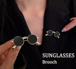 Unique vintage metal glasses shaped pins that add a touch of punk style to your outfit. These mini sunglasses brooches are perfect for both women and men, making them versatile accessories for any party or special occasion. Elevate your clothing game with these trendy and eye-catching pieces.