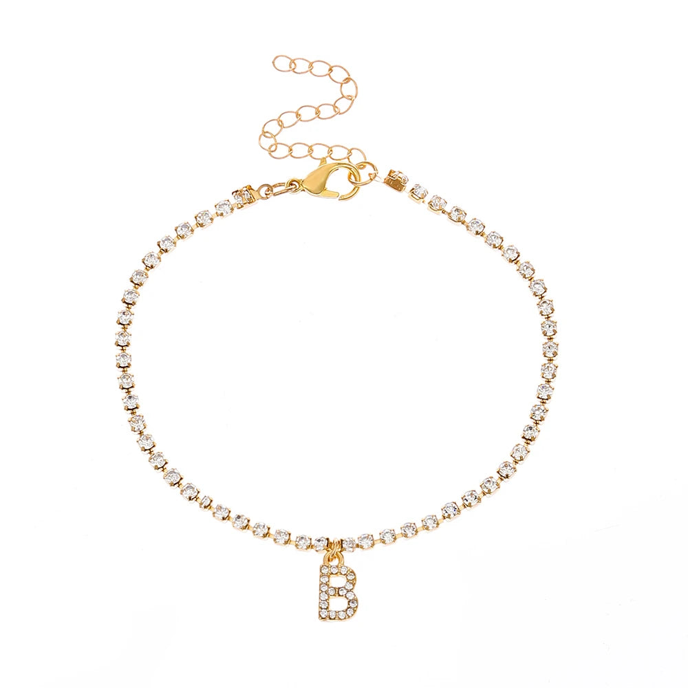 This ankle bracelet features an initial letter design with crystal zircon accents, perfect for women looking for a stylish foot chain to wear at the beach or as boho jewelry.