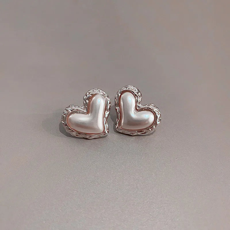 The latest addition to our collection, the Flower Heart Earrings . These French-inspired retro fashion accessories are the epitome of luxury, designed exclusively for women. Perfect for weddings and special occasions, these earrings are a must-have in every jewelry collection.