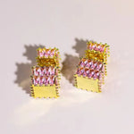The exquisite earrings adorned with dazzling zircon gemstones, radiating elegance and sophistication. These square golden earrings are a symbol of luxury and make for the perfect Christmas gift for women, adding a touch of cuteness to any outfit.