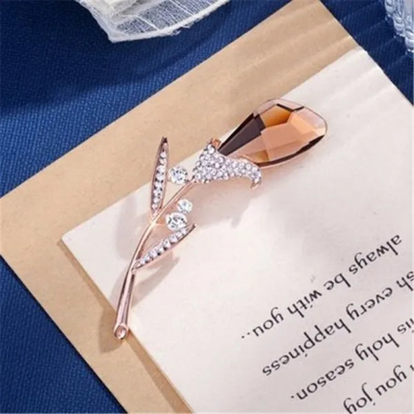 A stunning collection of opal stone and rhinestone brooches featuring rose flower designs. These exquisite brooches are perfect for women to accessorize their fashion clothing, especially for weddings. They make wonderful gifts for any occasion and are a must-have addition to any jewelry collection.