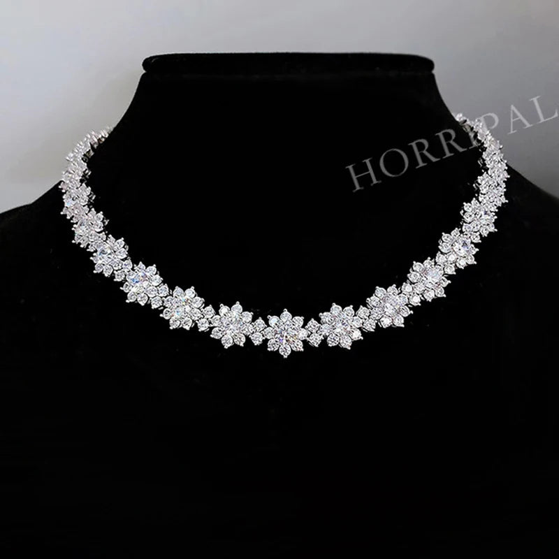 This elegant sunflower wedding chain for women is a luxurious and exquisite piece of jewelry. Made with a 34.96-38.96CT DVVS1 full moissanite necklace, it exudes a sense of opulence and sophistication. Crafted with S925 silver, this necklace is of high quality and perfect for any special occasion. Available at wholesale prices, it is a great option for those looking for a stunning and affordable piece of jewelry.