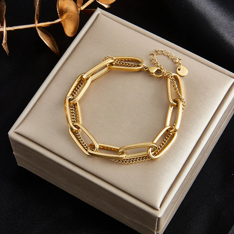  A stylish and elegant choice, this fashion link chain bangle bracelet is crafted from 316L stainless steel. The bracelet showcases a beautiful gold color, adding a touch of sophistication to any outfit. It makes for a thoughtful gift for girls who appreciate fine jewelry.