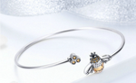 Stunningly crafted with exquisite 925 sterling silver, this Trendy Bee Bangle sparkles with beautiful Zircon stones! With a diameter of 6.5cm, this delightful piece is perfect for stylish women of any age! Look and feel your best wearing this exquisite piece of jewelry!