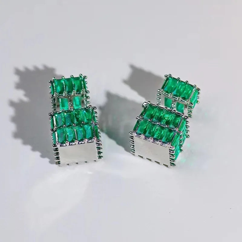The exquisite earrings adorned with dazzling zircon gemstones, radiating elegance and sophistication. These square golden earrings are a symbol of luxury and make for the perfect Christmas gift for women, adding a touch of cuteness to any outfit.
