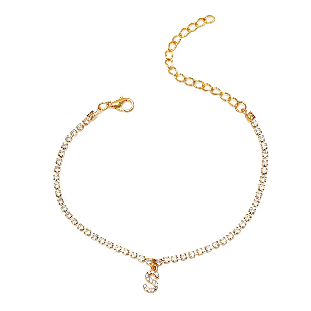 This ankle bracelet features an initial letter design with crystal zircon accents, perfect for women looking for a stylish foot chain to wear at the beach or as boho jewelry.