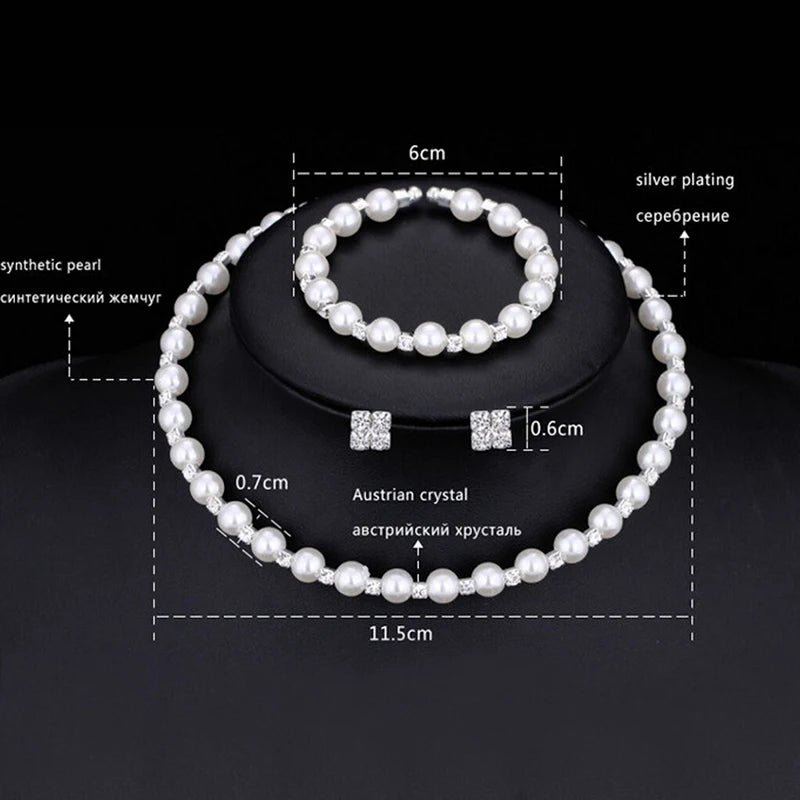 Enhance your bridal party's look with this stunning set of pearl crystal bridesmaid wedding jewelry, including a necklace, bracelet, and earrings. Elevate your bridesmaids' style with this elegant and timeless accessory set.