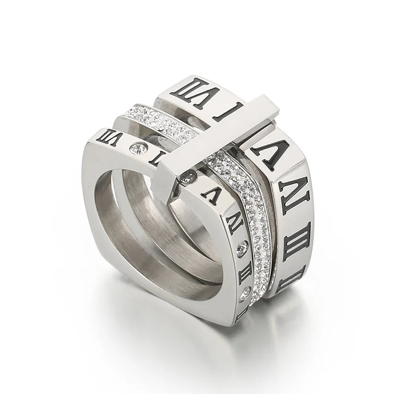 Elegant and stylish fashion jewelry with our collection of stainless steel rings for women. These rings feature black rhinestones and engraved Roman numerals, adding a touch of sophistication to any outfit. With three layers and a square design, these wedding bands are the perfect choice for those seeking a unique and fashionable accessory.