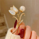 A stunning collection of opal stone and rhinestone brooches featuring rose flower designs. These exquisite brooches are perfect for women to accessorize their fashion clothing, especially for weddings. They make wonderful gifts for any occasion and are a must-have addition to any jewelry collection.