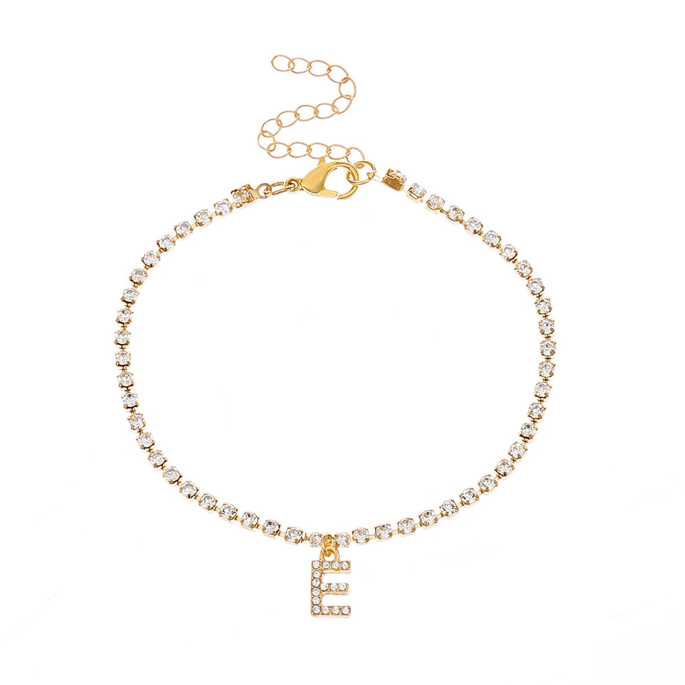 This ankle bracelet features an initial letter design with crystal zircon accents, perfect for women looking for a stylish foot chain to wear at the beach or as boho jewelry.