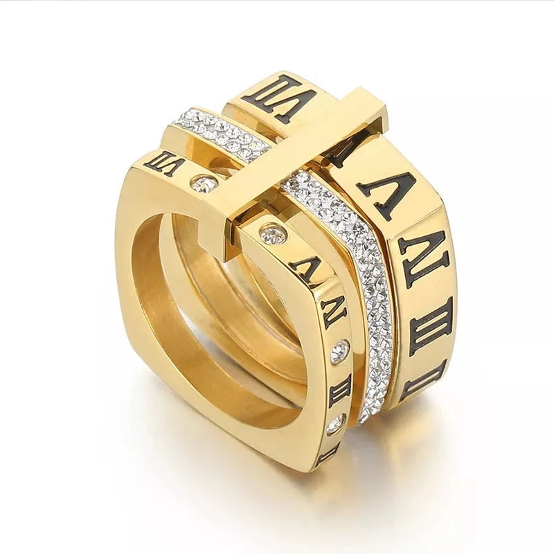 Elegant and stylish fashion jewelry with our collection of stainless steel rings for women. These rings feature black rhinestones and engraved Roman numerals, adding a touch of sophistication to any outfit. With three layers and a square design, these wedding bands are the perfect choice for those seeking a unique and fashionable accessory.