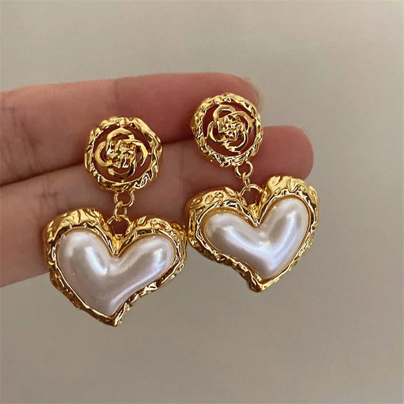 The latest addition to our collection, the Flower Heart Earrings . These French-inspired retro fashion accessories are the epitome of luxury, designed exclusively for women. Perfect for weddings and special occasions, these earrings are a must-have in every jewelry collection.