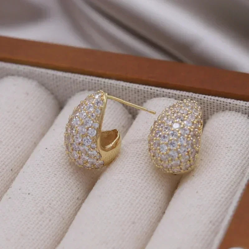 Introducing the elegant women's wedding party accessories, we present the luxurious square zircon pendant earrings in 16K gold plated fashion jewelry from Korea. This new design is sure to add a touch of sophistication to any outfit.