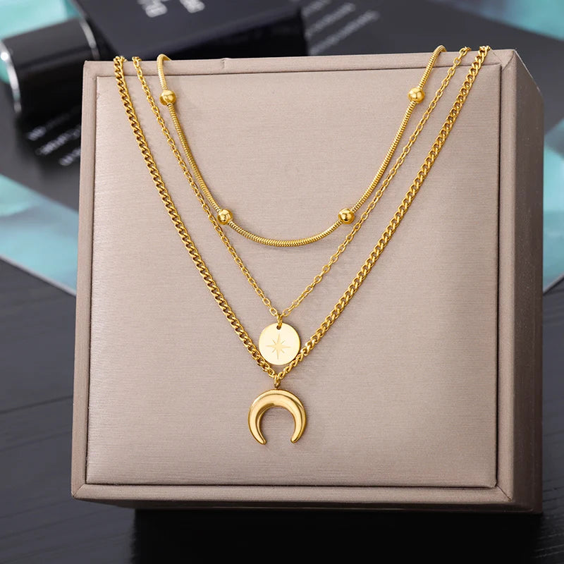 This necklace features a multilayer chain with a pendant in the shape of a star, moon, and butterfly. It is made of stainless steel and is designed as a choker necklace. It is a perfect accessory for women's wedding attire .