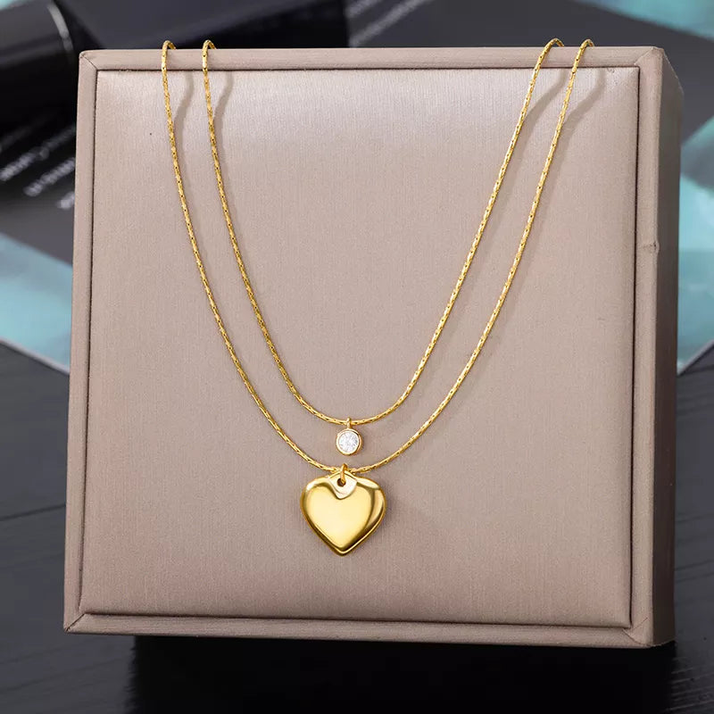 This necklace features a multilayer chain with a pendant in the shape of a star, moon, and butterfly. It is made of stainless steel and is designed as a choker necklace. It is a perfect accessory for women's wedding attire .